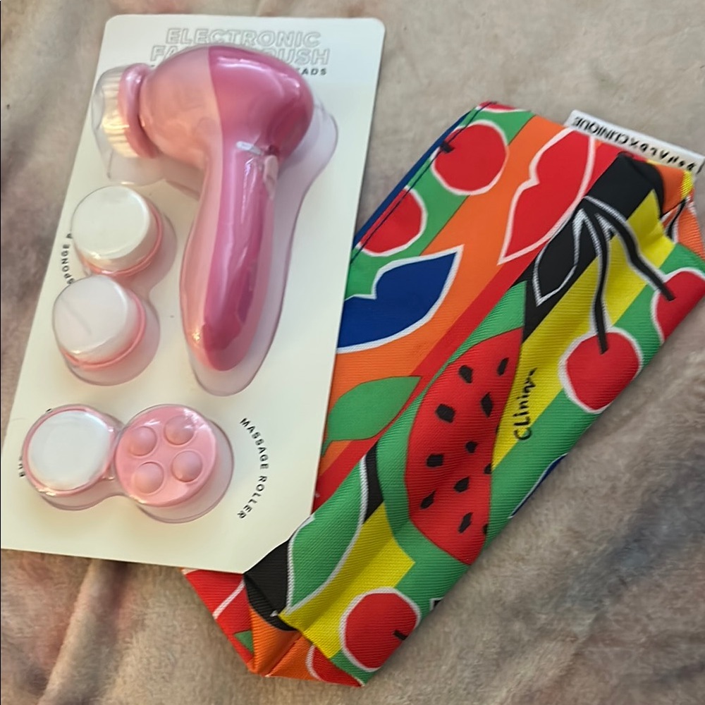 Facial Cleansing Brush And Clinique Cosmetic Case